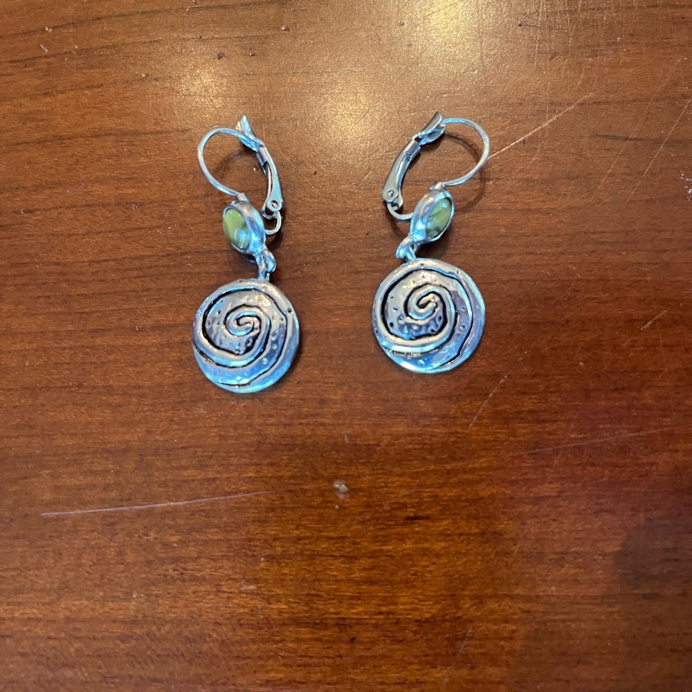 Modernist abstract silver-toned swirl dangle earrings with a green accent stone